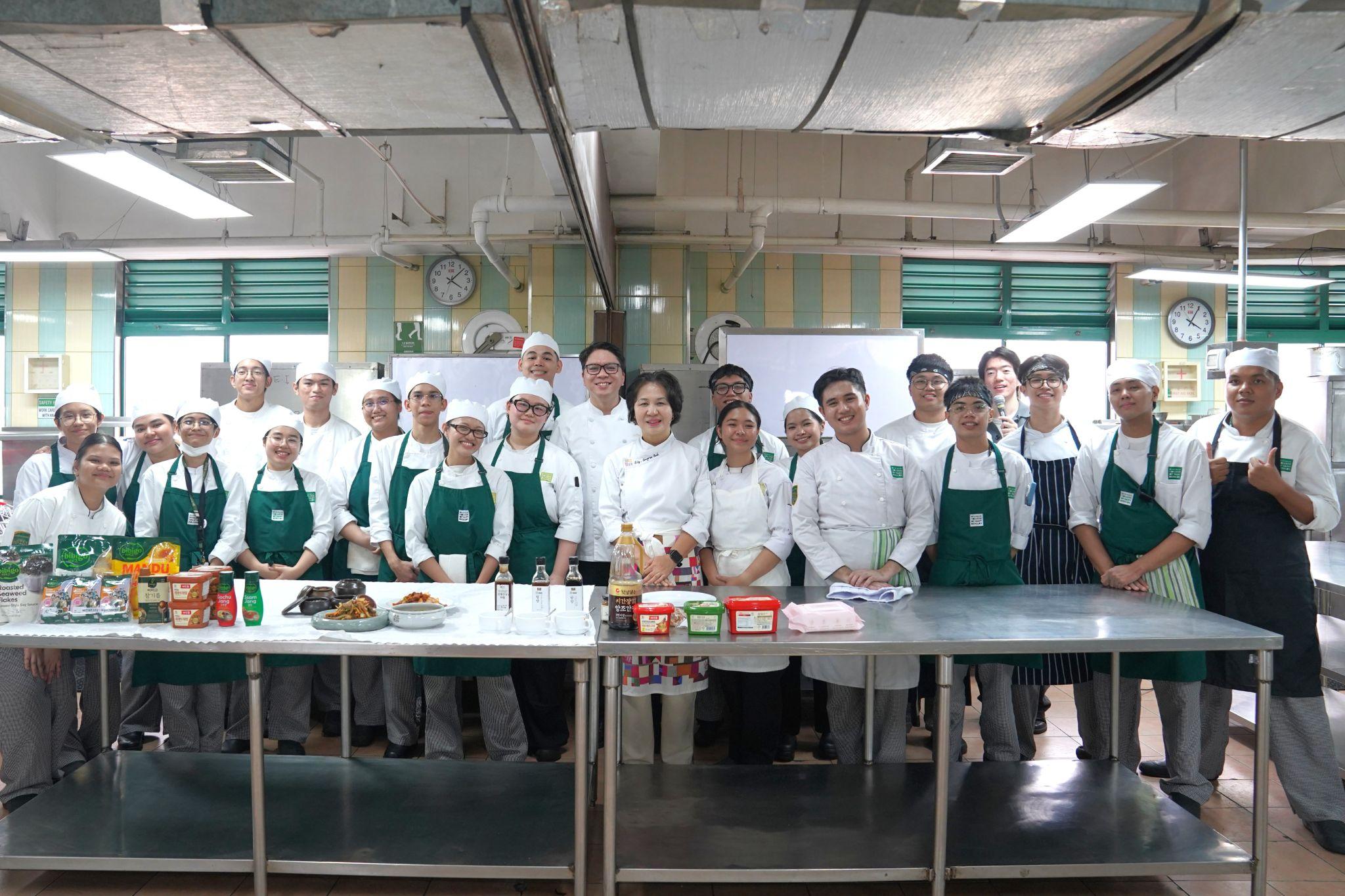 Photo 8.&nbsp;Students pose after successfully recreating traditional Korean dishes.