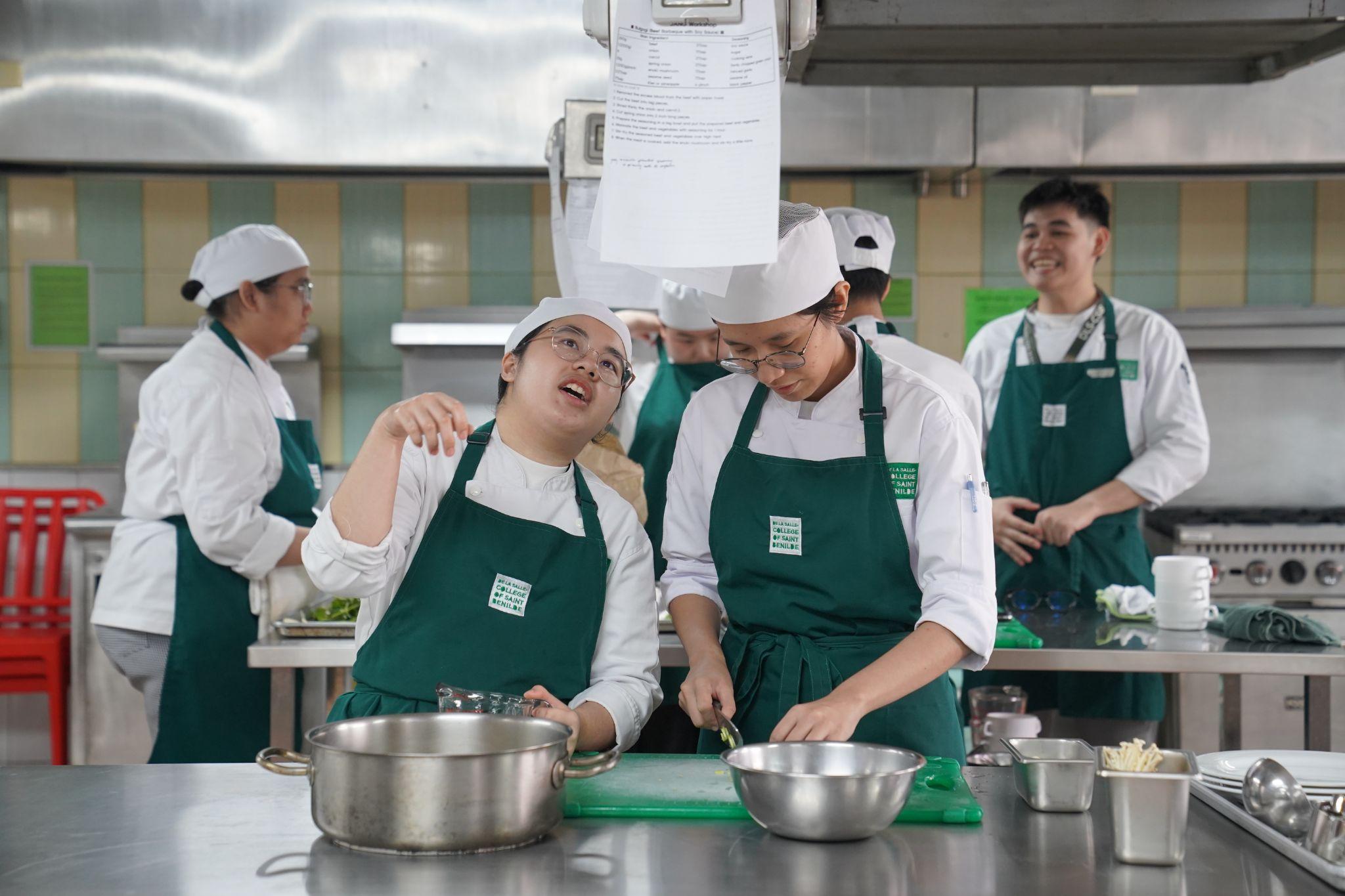 Photo 7.&nbsp;SHRIM students participate in hands-on cooking activities.